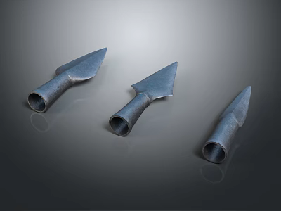 Three Metallic Arrowheads With Shiny Surfaces Displayed On Dark Background 3d model