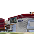 Modern Commercial Complex Featuring Red And White Facade Circular Roof Structures And Landscaped Surroundings