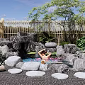 Garden Courtyard With Stone Surrounded Pool Rose Petals Relaxation Area Bamboo Fence And Green Trees