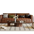 Brown Leather Sofa With Cushions And Wooden Coffee Table With White Flowers On Checkered Rug