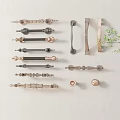 Display Of Various Decorative Metal Handles With Different Styles And Colors