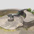 Historic Military Weapon Ancient Cannon on Circular Stone Platform With Stone Walls and Green Plants