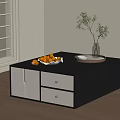 Black Coffee Table with White Drawers Cabinets Oranges Green Plant and Tray