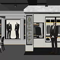 Luxury Men's Clothing Store Interior with Suits Mannequins Hanging Apparel and Seating Area
