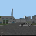 Industrial Plant Aerial View Building Complex With Blue Roofs Greenery Roads and Facilities
