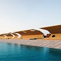 Outdoor Waterfront Landscape Seats With Wooden Wave Like Structure And Stone Pavement
