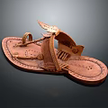 Brown Handcrafted Leather Slippers With Woven Straps And Intricate Embroidered Patterns
