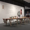 Art Exhibition Space Interior With White Walls Long Tables And Artworks 3d model