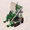 Green Black Mechanical Device with Reels Wheels And Metal Frame on Wooden Floor Surface