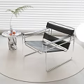Modern Metal Frame Leisure Chair with Black Seat Small Round Side Table and Green Plant