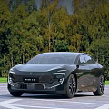 Modern Black Car With Sleek Exterior Design Parked Outdoor Near Green Trees