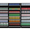 Neatly Arranged Display Shelves With Various Colored Bottles And Cans In Store