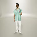 Man In Green Medical Scrubs And White Pants Holding Stethoscope Standing Against Gray Background