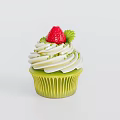 Delicious Green Cupcake with White Frosting Topped with Fresh Red Strawberry and Green Decorations