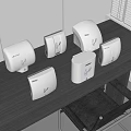 Sleek White Hand Dryers Arranged On Dark Office Table With Modern Design