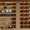 Chinese Style Wooden Display Cabinet With Neatly Arranged Tea Sets Teapots Cups And Canisters