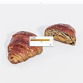 Fresh Golden Brown Croissants Whole and Sliced with Flaky Layers