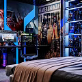 Gaming Desk Setup With Dual Monitors Displaying Gameplay Keyboard Mouse And Figurines