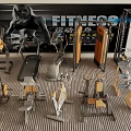 Variety Of Fitness Equipment Including Treadmill Dumbbells And Fitness Ball In Gym Setting
