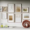 Gallery Wall With Framed Artworks And Circular Decor In Living Room
