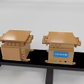 Two Brown Industrial Packaging Machines With Control Buttons On Black Platform 3d model