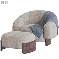 Plush Orange Lounge Chair With Matching Ottoman Blue Throw Blanket And Wooden Legs