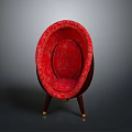Red Patterned Oval Shaped Chair With Wooden Legs And Golden Accents