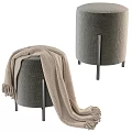 Gray Ottoman With Metal Legs And Beige Knitted Blanket On Top