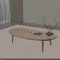 Minimalist Wooden Oval Coffee Table With Teacups Tray And Twig Vase In Living Room