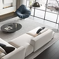 Modern White Sofa and Round Coffee Table Set with Throw Pillows in Spacious Living Area