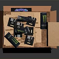 Open Orange Snack Box With Monster Energy Drinks Snacks And Strangeways Card