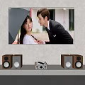 Large Screen Television With Surround Speakers And Home Theater Setup In Modern Interior
