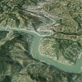 Aerial View Of Mountainous Landscape With Winding River And Village Valley