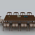 Wooden Conference Table Surrounded by Light Upholstered Chairs With Blue Teapot and Decorative Items