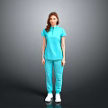 A woman in light blue top and pants standing against gray background wearing white shoes