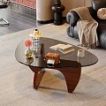 Glass Top Coffee Table with Wooden Legs Flower Vase Books Lantern in Cozy Living Room