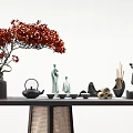 Ornament Decor Combination With Red Flowering Tree Green Figurines Black Teapot And Wooden Table