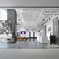 Store Front Desk With ADZ Logo White Counter Chandelier Sofa And Cactus In Spacious Lobby