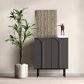 Black Entryway Cabinet Sideboard with Arched Doors Decorative Sculpture and Green Plant in Light Wall Interior