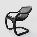 Modern Black Lounge Chair With Curved Armrests And Woven Seat Design