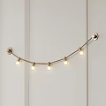 Golden Curved Chandelier With Five Round Bulbs On White Vertical Striped Wall