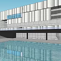 Modern Museum Building With White Stone Facade Overhanging Structure And Surrounding Greenery