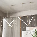 Modern Circular Pendant Lights With Gold Frames LED Strips In Minimalist Interior With Green Plant