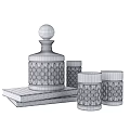 Crystal Glass Decanter And Glasses Filled With Amber Liquid On Stacked Books