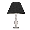 Classic Table Lamp With Black Lampshade And Decorative Metal Base Glowing Softly