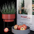 Ceramic Vessels Red Planter And Gray Bowl With Apples In Modern Interior With Picasso Poster