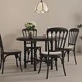 Vintage Style Black Round Dining Table With Four Comfortable Padded Chairs For Cozy Home Dining Room