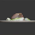 Braised Pork Knuckle with Red Sauce Bok Choy and Sesame Seeds on White Plate