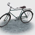 Vintage Green Bicycle With Steel Frame Brown Leather Seat On Brick Pavement
