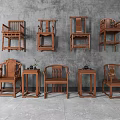 Traditional Chinese Wooden Armchairs With Intricate Carvings And Matching Side Tables